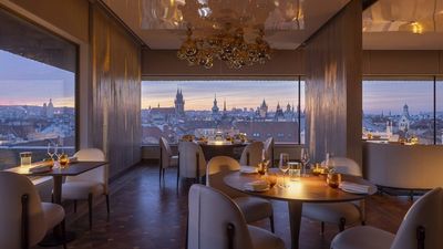 Zlata Praha Restaurant at Fairmont Prague offers modern Czech cuisine with panoramic city views, a romantic ambiance, and a rooftop terrace for a memorable dining experience.