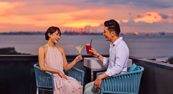 Perched atop The Outpost Hotel, 1-Altitude Coast offers stunning panoramic sea views and vibrant sunsets, perfect for cocktails, relaxation, and unforgettable evenings.