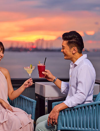 Perched atop The Outpost Hotel, 1-Altitude Coast offers stunning panoramic sea views and vibrant sunsets, perfect for cocktails, relaxation, and unforgettable evenings.
