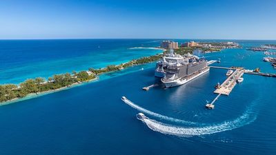 Nassau Cruise Port's success stems from its strategic location, steady growth, infrastructure improvements, unique Bahamian experiences, and strong partnerships with cruise lines, local businesses, and government.